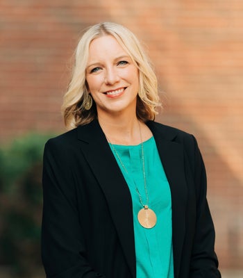 Portrait of Michelle Haag, Broker & Owner.