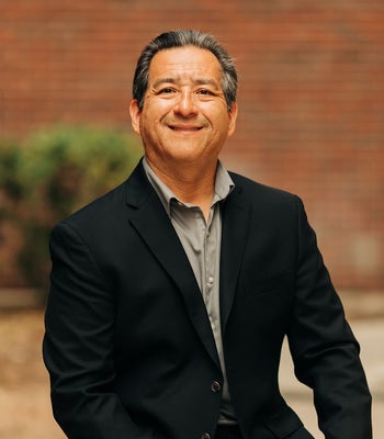 Portrait of Rene DeLaCruz, REALTOR®.